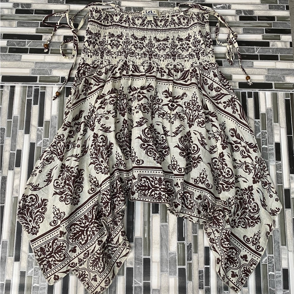 Selling a tank top, size large, cream color, black print, bandanna style print,
